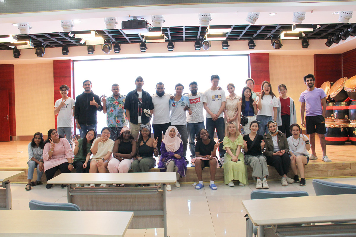 Wuhan University — Participants at the WHU-China and WISU healthy-cooking event (2024).
